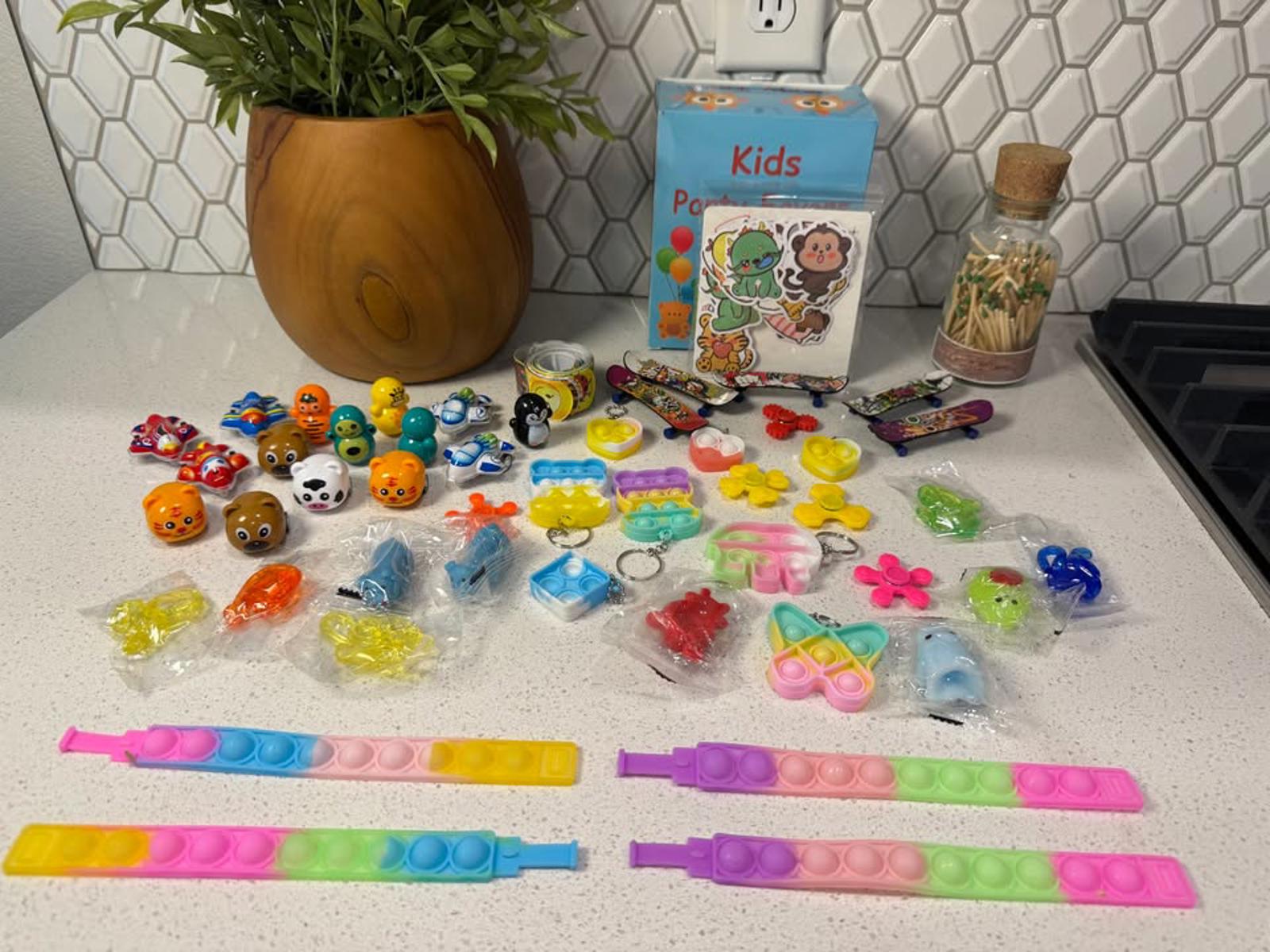 Kids Party Favors Toy Set with Assorted Mini Toys and Pop It Bracelets