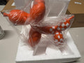 Orange Balloon Dog Sculpture with Checkerboard Pattern