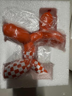 Orange Balloon Dog Sculpture with Checkerboard Pattern